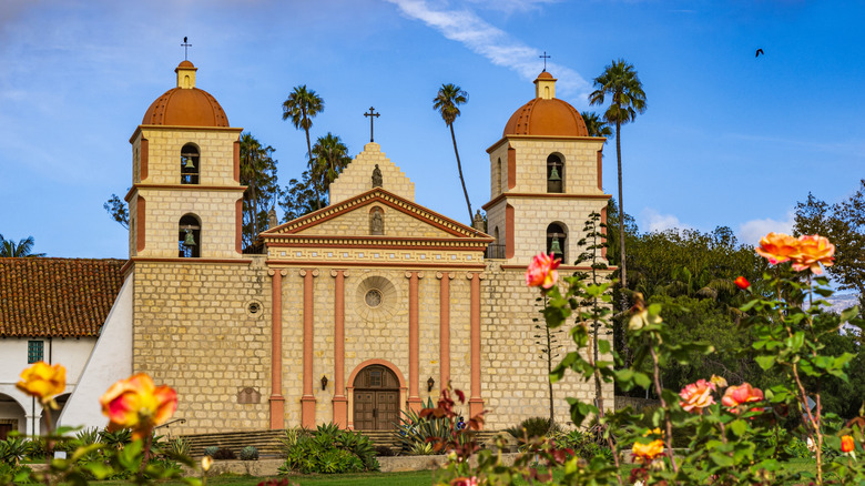The brick facade of the Mission Santa Barbara during the springtime