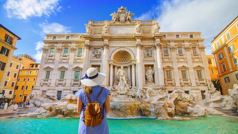 Woman in front of Trevi Fountain