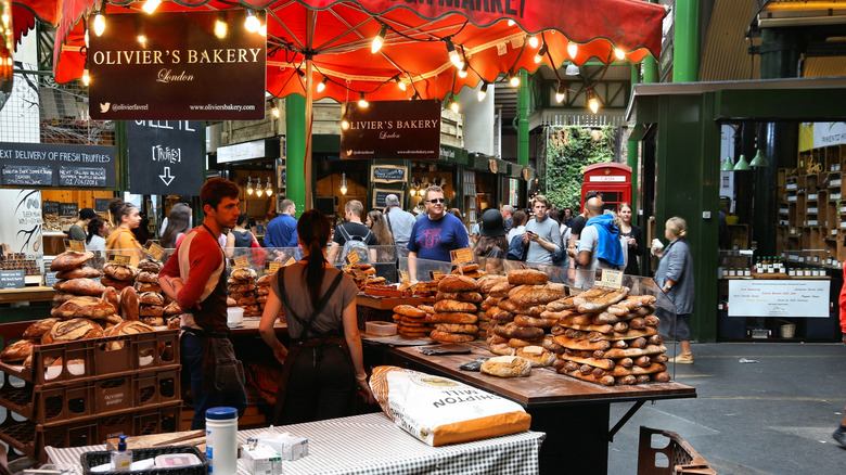 Shoppers and stalls at Borough Market in London