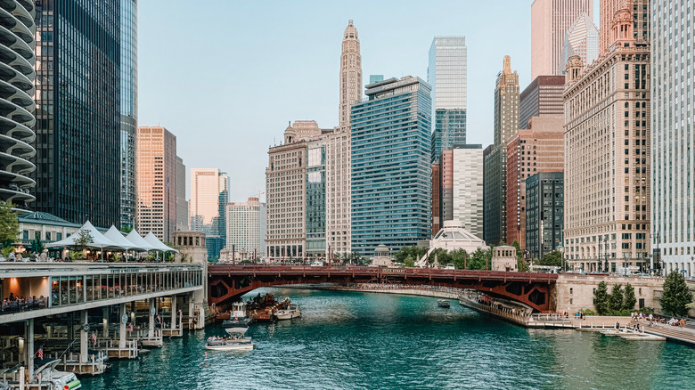 Skyline view from the river in Chicago with an iron bridge in the foreground