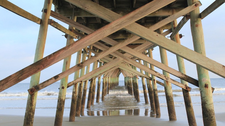 A view from underneath Sunset Beach Pier in Brunswick County, North Carolina