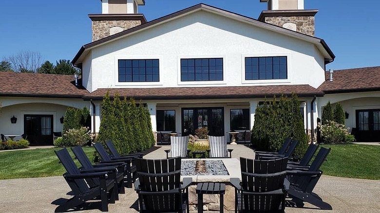 A fire pit in front of a winery building at Gervasi Vineyard Resort.