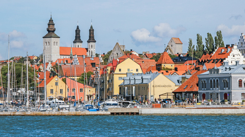 A port with a cathedral and buildings in Visby, Sweden