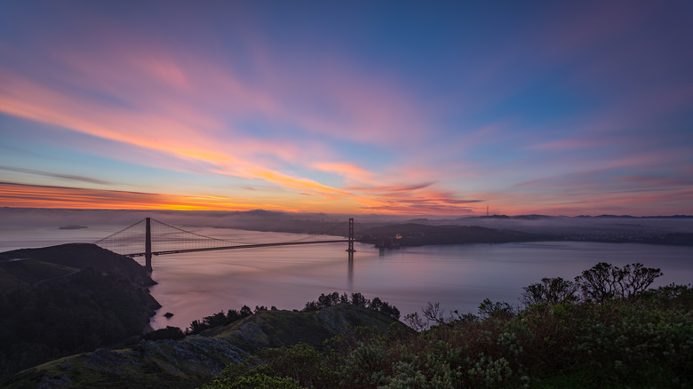 View of Golden Gate Bridge at sunset from Hawk Hill