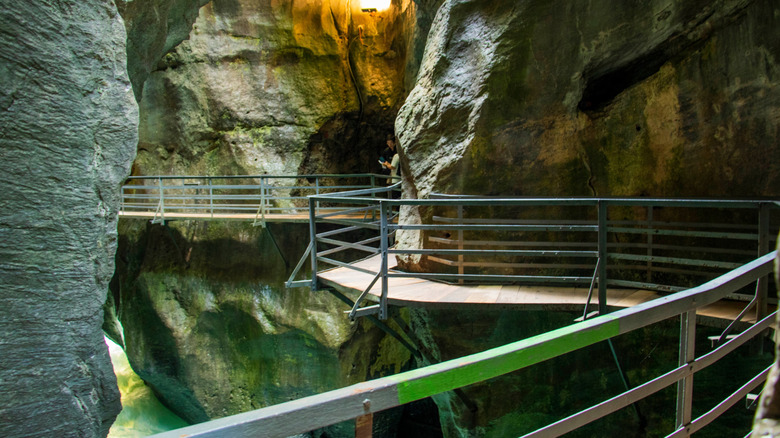 A narrow tunnel system of the winding Aare Gorge accessible trails