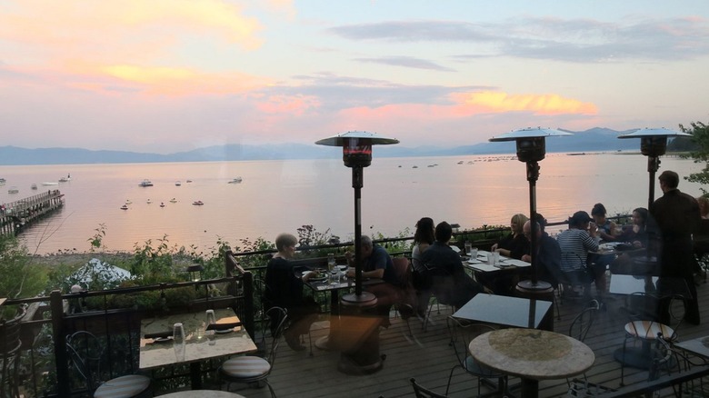 Sunset view of Lake Tahoe behind a terrace at Christy Hill