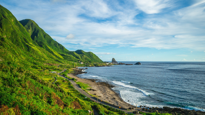 The rugged coastline of Lanyu island in Taiwan, where green mountains meet the deep blue sea