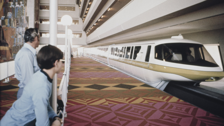 Staff watch the monorail arriving at the Disney World resort in Orlando in 1971
