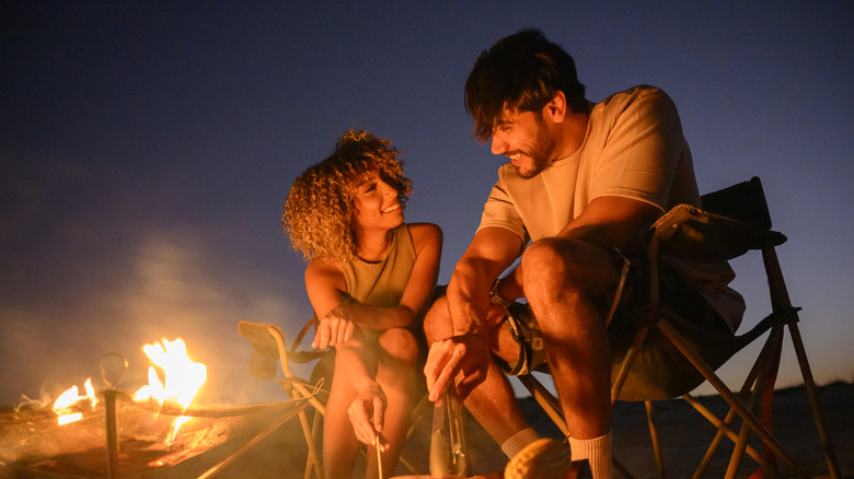 A young couple enjoying campground food