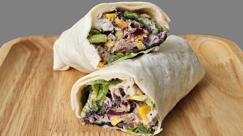 Tortilla wraps on a wooden plate