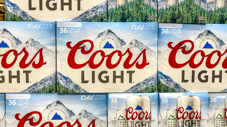 A stack of 36-packs of Coors Light with Wilson Peak on the box
