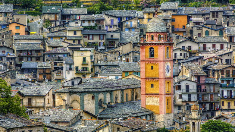 A yellow church tower rises from the maze of streets in Tende, France