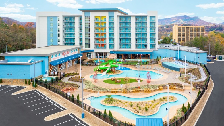 Outdoor view of the Compass Hotel in Tennessee, with pools in front