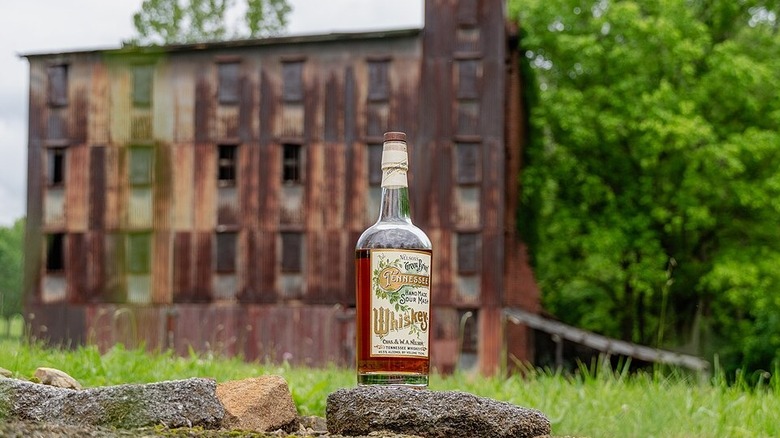 Nelson's Green Brier Original Barrel House with whiskey bottle