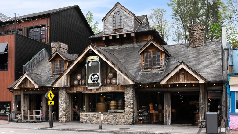 The Ole Smoky Moonshine Distillery, a rustic stone-faced building