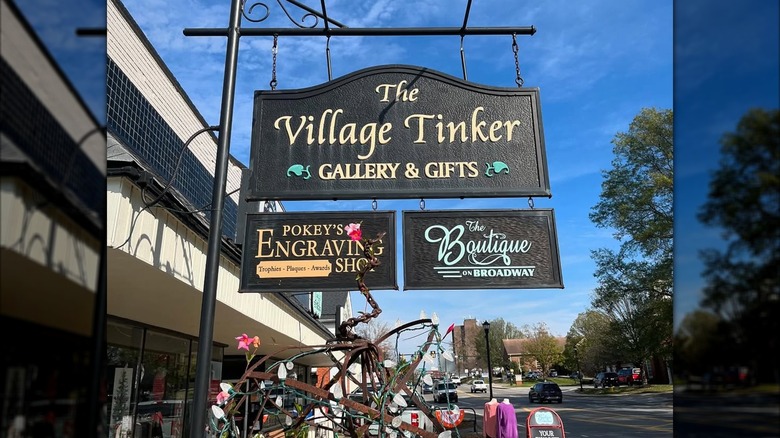 Signs of The Village Tinker, The Boutique on Broadway, and Pokey's Engraving Shop in downtown Maryville, Tennessee