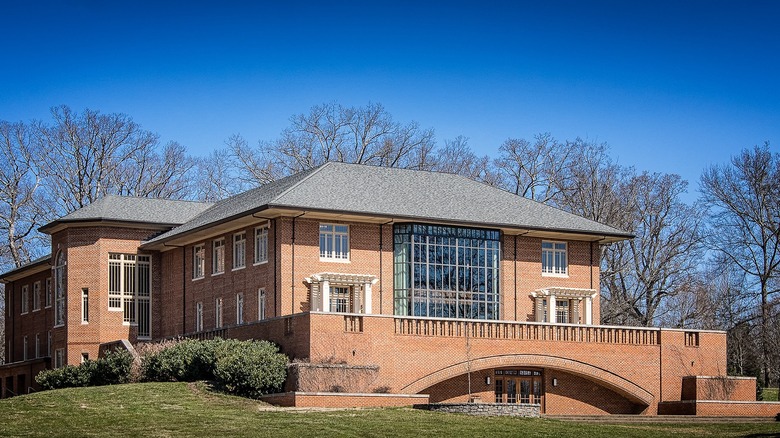 Tusculum's red brick library building with trees in winter