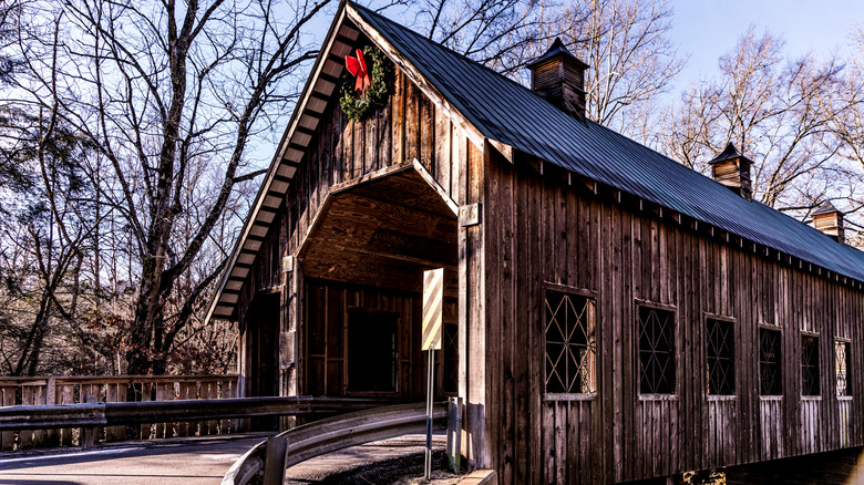 Side view of a wooden bridge in Sevierville, Tennessee with a wreath in the center
