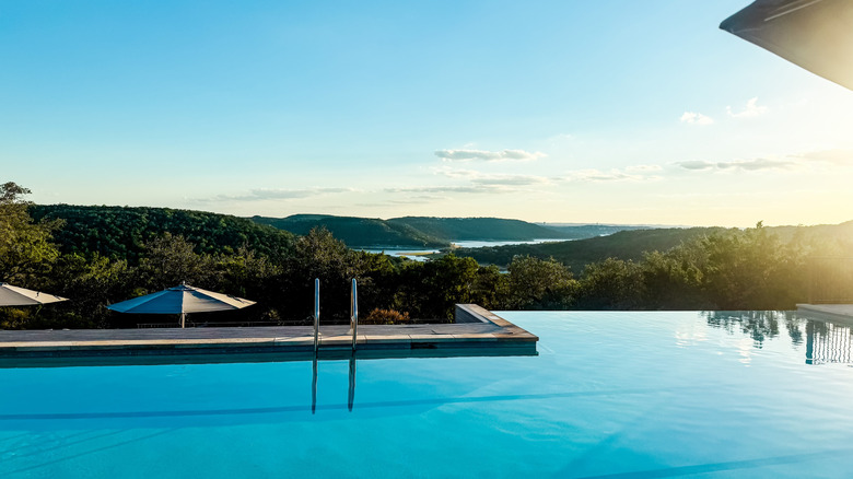 Infinity pool looking out over a hilly landscape at Miraval Austin