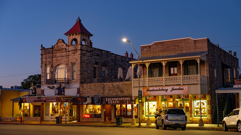 Downtown Fredericksburg, Texas, at night, featuring a blend of German and American West-style architecture