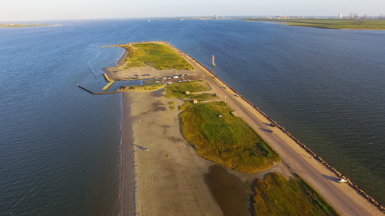 Aerial view of Texas City Dike, a strip of land with sandy shores surrounded by water