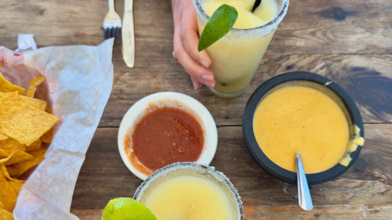 Top-down view of queso and margarita in El Arroyo