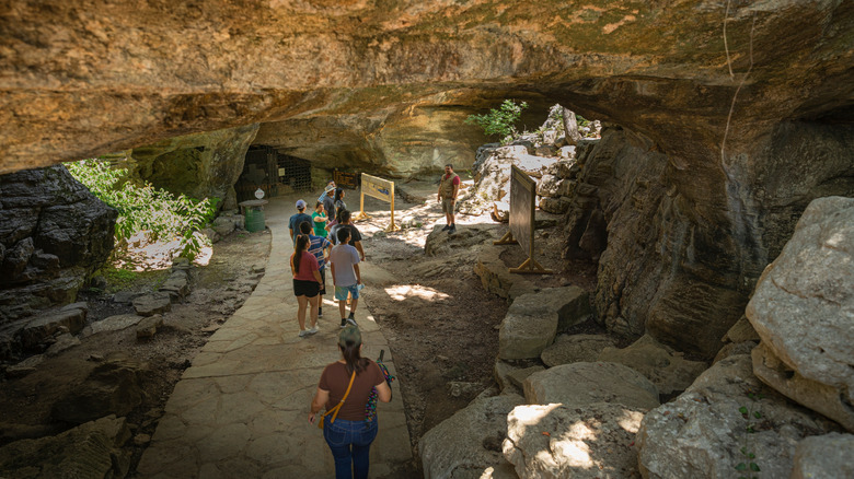 Visitors at the entrance to Longhorn Cavern State Park, Texas