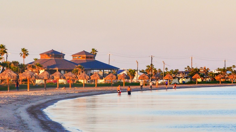 Beachgoers enjoying sunrise at Rockport Beach in Texas