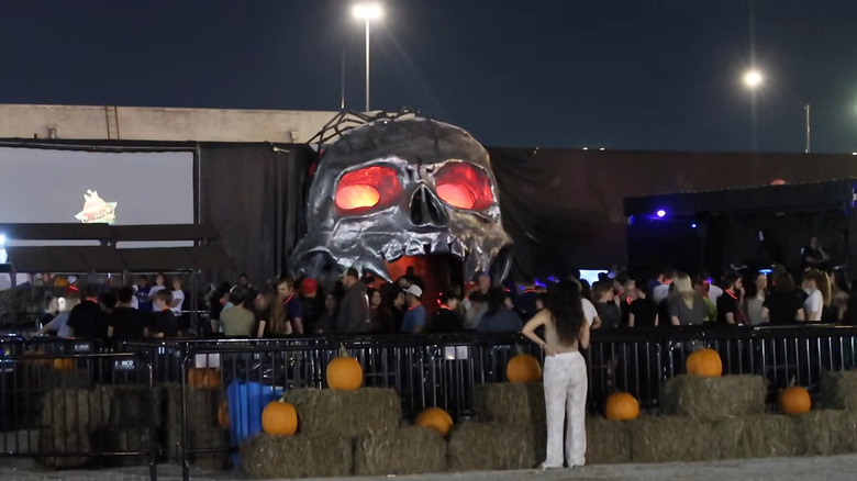 Skull with glowing eyes at entrance to Cutting Edge Haunted House in Fort Worth