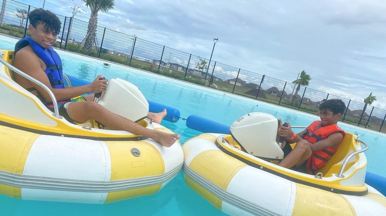 Two teens enjoy the bumber boats at Lago Mar