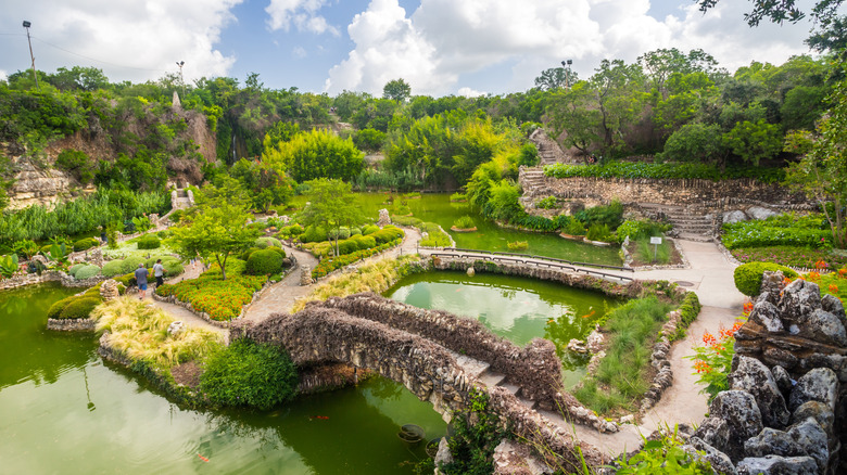 A wide-angle view of the greenspaces, walkways, and ponds of San Antonio's Japanese Tea Garden