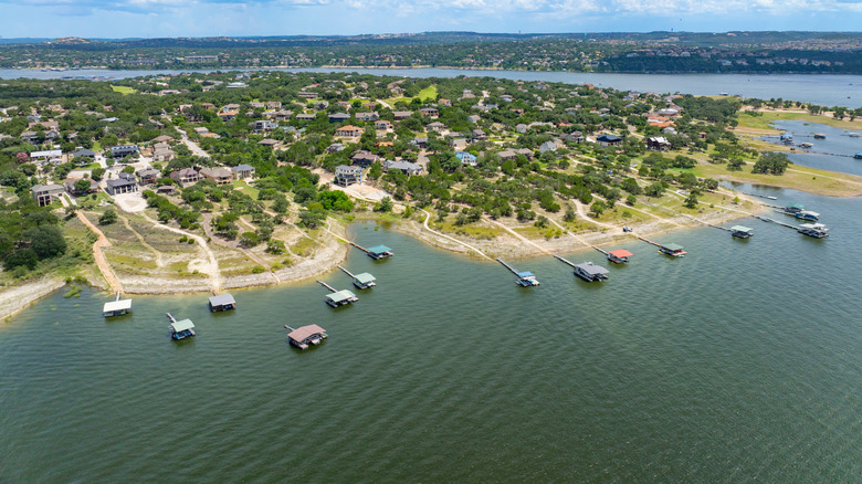 Aerial view of houses, resorts, and floating houses on Lake Travis in Texas.