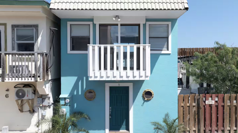 Bright blue cottage exterior