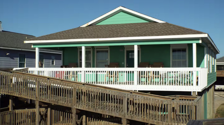 Turquoise cottage with ramp
