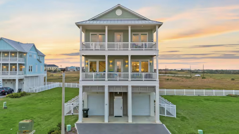 Three-story house at sunset