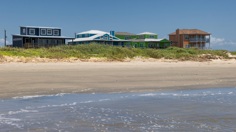 Houses overlooking the shore at Jamaica Beach on Galveston Island in Texas