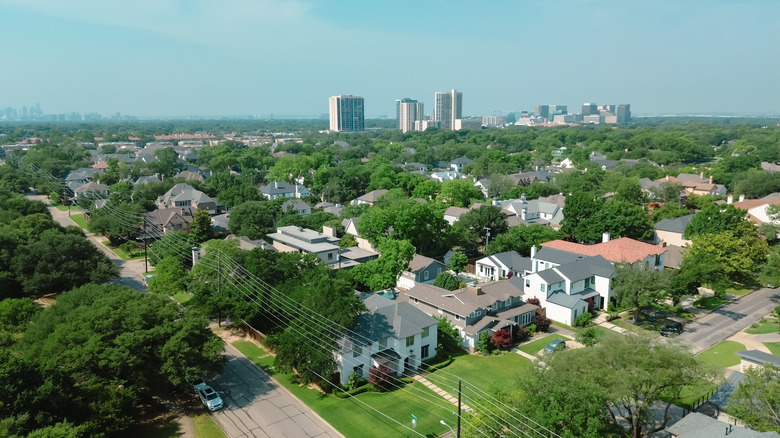 Aerial view of Park Cities neighborhoods with Dallas skyline in background