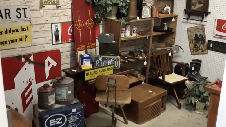Furniture and signs inside Allen Antique Barn in Allen, Michigan