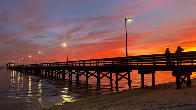 Sunset over Biloxi Beach boardwalk