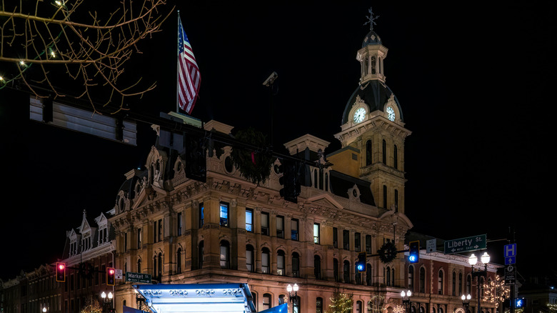The image depicts the annual window lighting ceremony in downtown Wooster, Ohio.