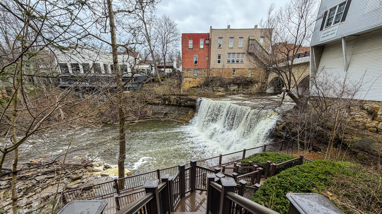 A waterfall spouting off the Chagrin River and steps to a viewing platform.