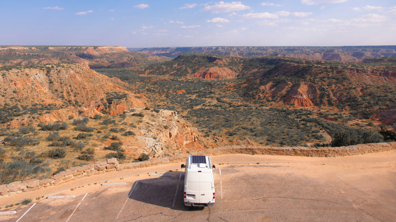 A campervan parked in a lot overlooking Palo Duro Canyon in Texas