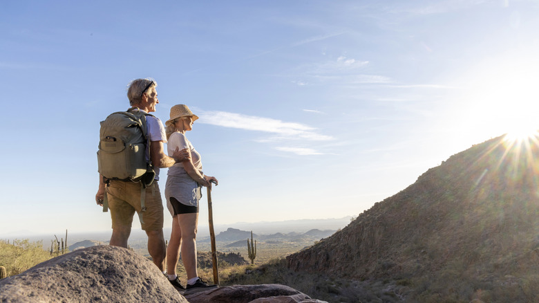 A golden-aged couple hiking in Arizona