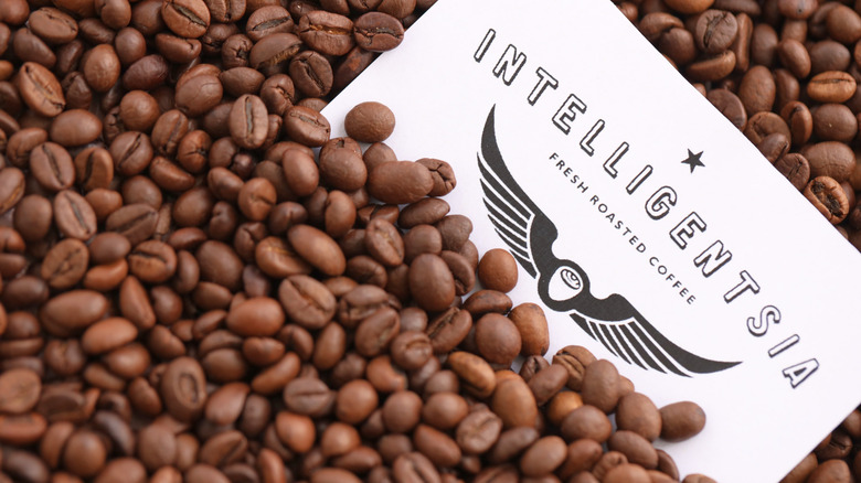 Intelligentsia coffee brand logo on big pile of coffee beans close up