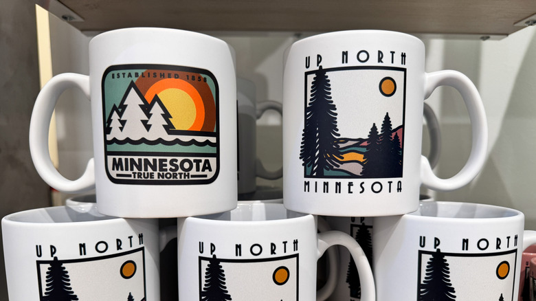 Minnesota-themed coffee mugs for sale at a gift shop