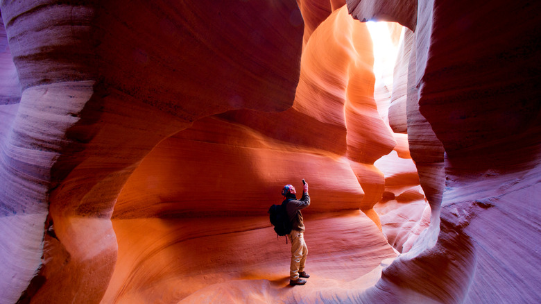 Hiker in Antelope slot canyon in Arizona