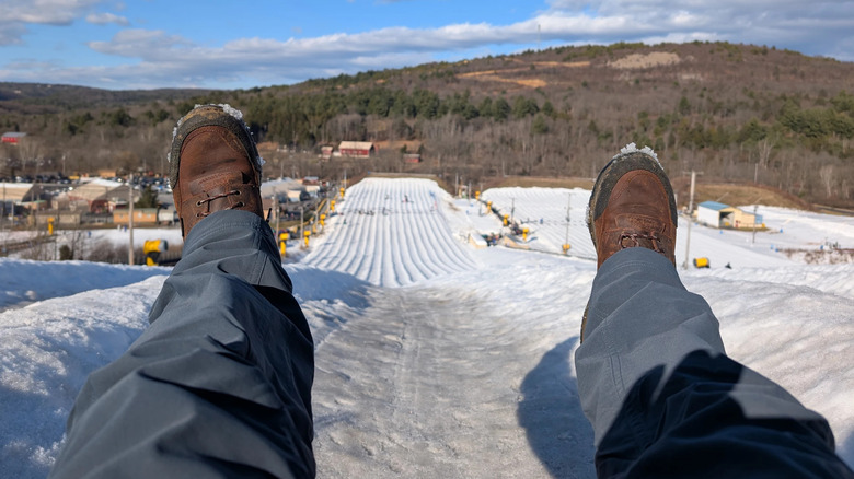 An adult tubing down the hill at Blue Mountain Resort in the Poconos, Pennsylvania