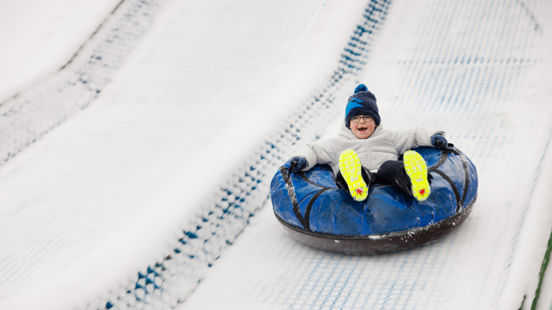 A child snow tubing