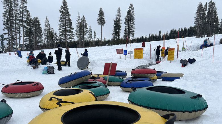 Inner tubes gathered on a snow tubing hill