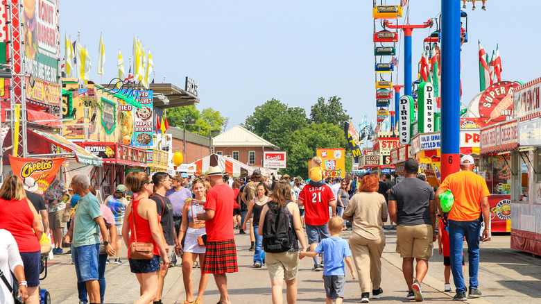 People walking by concession stands at the Ohio State Fair in Columbus